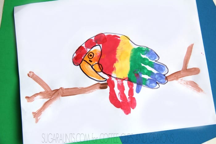 Make cute parrot hand print  art for childhood keepsake art!